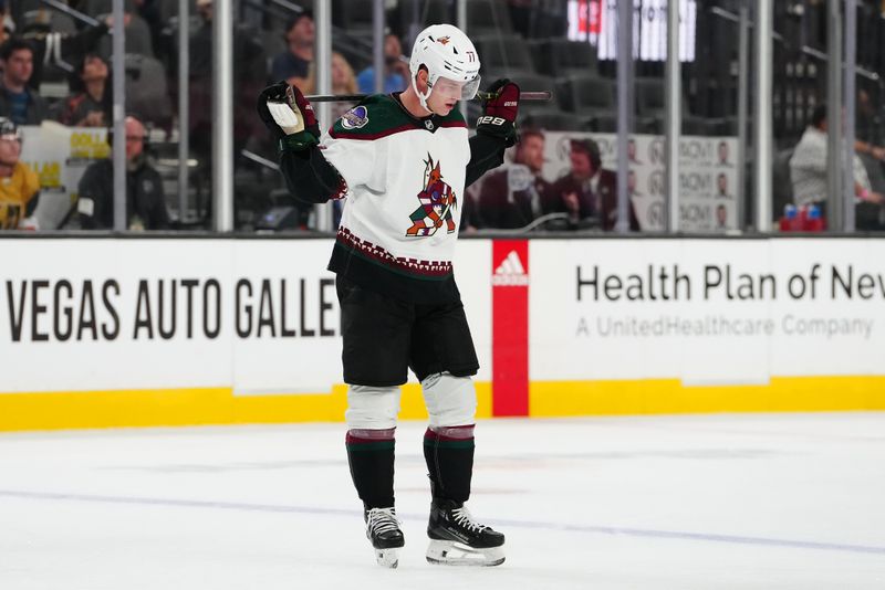 Sep 29, 2023; Las Vegas, Nevada, USA; Arizona Coyotes defenseman Victor Soderstrom (77) reacts after hitting a crossbar behind Vegas Golden Knights goaltender Logan Thompson (36) during the third period of a preseason game at T-Mobile Arena. Mandatory Credit: Stephen R. Sylvanie-USA TODAY Sports