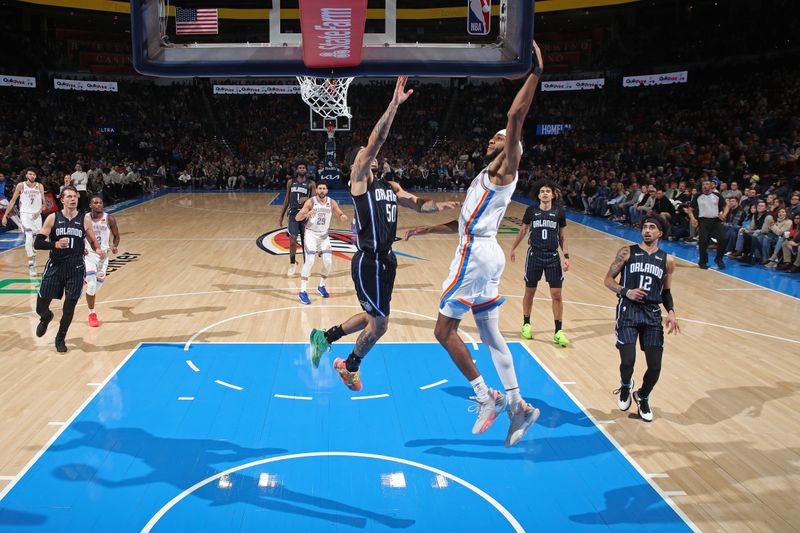 OKLAHOMA CITY, OK - JANUARY 13: Isaiah Joe #11 of the Oklahoma City Thunder dunks the ball during the game against the Orlando Magic on January 13, 2024 at Paycom Arena in Oklahoma City, Oklahoma. NOTE TO USER: User expressly acknowledges and agrees that, by downloading and or using this photograph, User is consenting to the terms and conditions of the Getty Images License Agreement. Mandatory Copyright Notice: Copyright 2024 NBAE (Photo by Zach Beeker/NBAE via Getty Images)