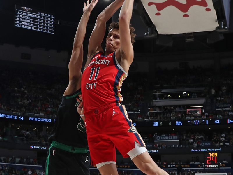 NEW ORLEANS, LA - MARCH 30: Dyson Daniels #11 of the New Orleans Pelicans rebounds during the game against the Boston Celtics on March 30, 2024 at the Smoothie King Center in New Orleans, Louisiana. NOTE TO USER: User expressly acknowledges and agrees that, by downloading and or using this Photograph, user is consenting to the terms and conditions of the Getty Images License Agreement. Mandatory Copyright Notice: Copyright 2024 NBAE (Photo by Layne Murdoch Jr./NBAE via Getty Images)