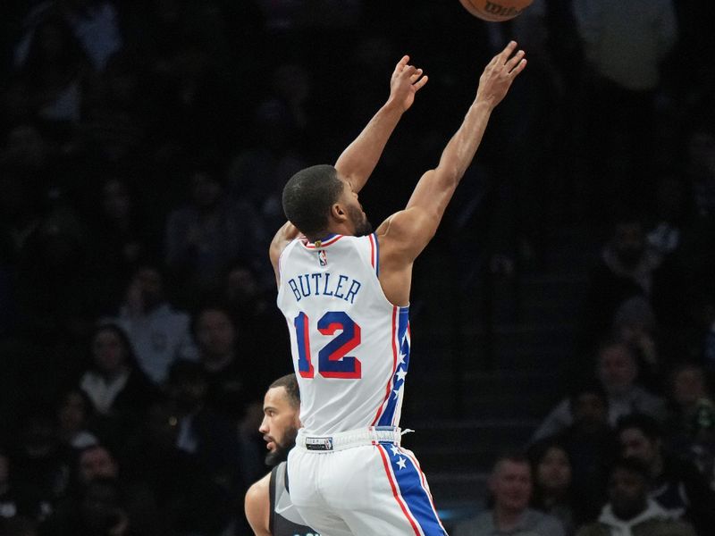 BROOKLYN, NY - FEBRUARY 12: Jared Butler #12 of the Philadelphia 76ers shoots the ball during the game against the Brooklyn Nets on February 12, 2025 at Barclays Center in Brooklyn, New York. NOTE TO USER: User expressly acknowledges and agrees that, by downloading and or using this Photograph, user is consenting to the terms and conditions of the Getty Images License Agreement. Mandatory Copyright Notice: Copyright 2025 NBAE (Photo by Jesse D. Garrabrant/NBAE via Getty Images)