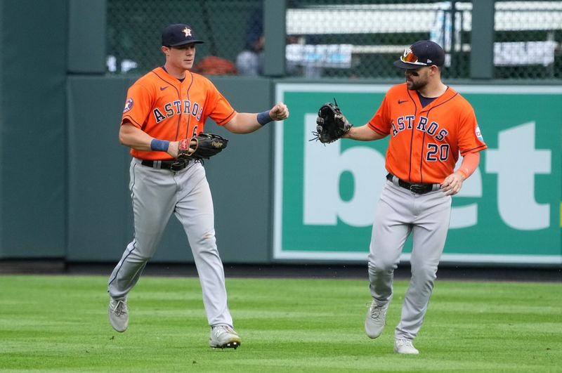 Jul 19, 2023; Denver, Colorado, USA; Houston Astros center fielder Jake Meyers (6) and right fielder Chas McCormick (20) celebrate defeating the Colorado Rockies at Coors Field. Mandatory Credit: Ron Chenoy-USA TODAY Sports