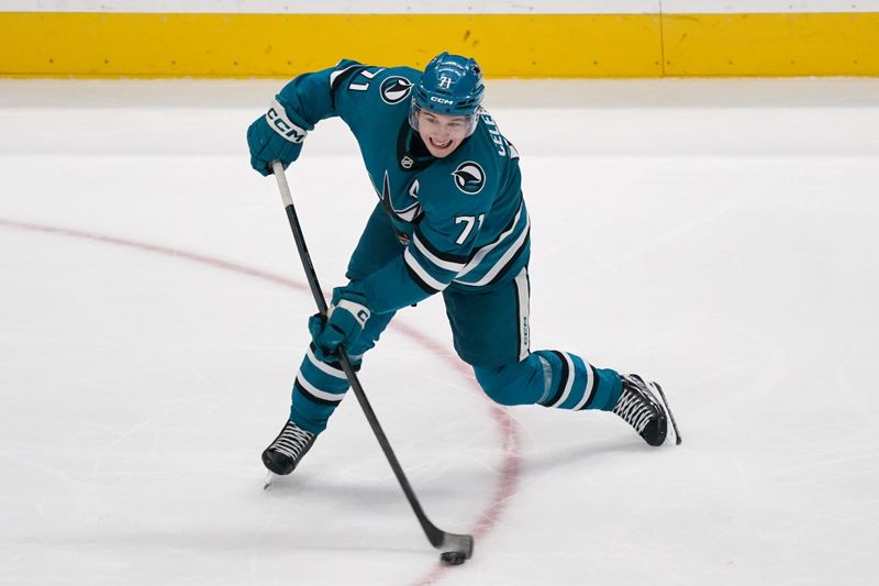 Nov 7, 2025; San Jose, California, USA;  San Jose Sharks center Macklin Celebrini (71) shoots the puck against the Winnipeg Jets during the third period at SAP Center at San Jose. Mandatory Credit: David Gonzales-Imagn Images