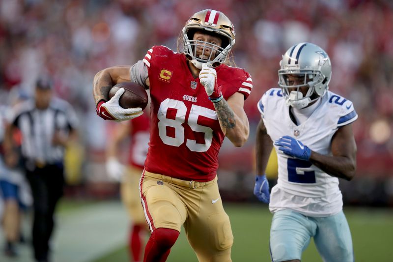 San Francisco 49ers tight end George Kittle (85) runs for a TD during an NFL football game against the Dallas Cowboys, Sunday, Oct 8, 2023, in Santa Clara, Calif. (AP Photo/Scot Tucker)