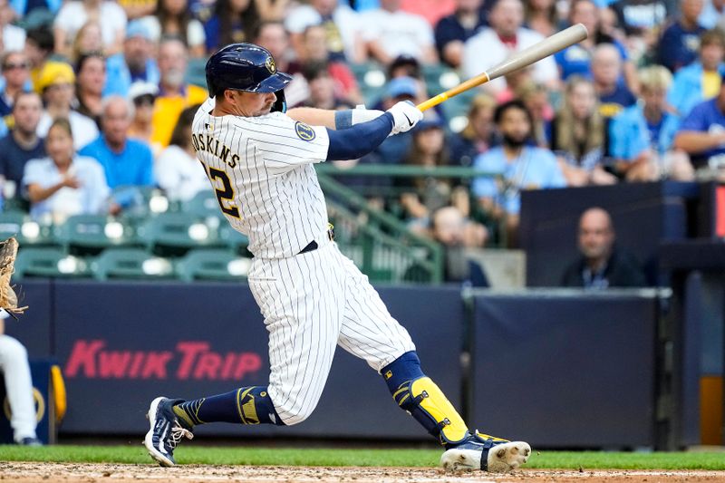 Jul 27, 2024; Milwaukee, Wisconsin, USA;  Milwaukee Brewers first baseman Rhys Hoskins (12) hits a home run during the fourth inning against the Miami Marlins at American Family Field. Mandatory Credit: Jeff Hanisch-USA TODAY Sports