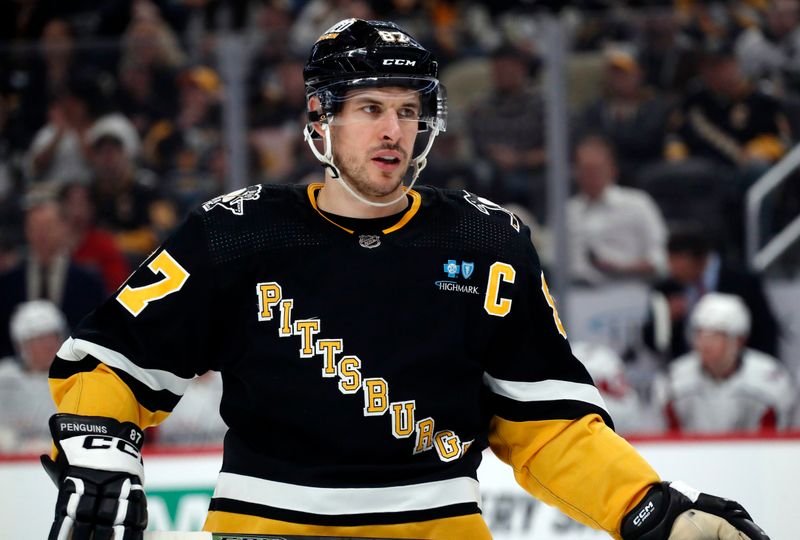 Mar 7, 2024; Pittsburgh, Pennsylvania, USA; Pittsburgh Penguins center Sidney Crosby (87) looks on against the Washington Capitals during the first period at PPG Paints Arena. The Capitals shutout the Penguins 6-0. Mandatory Credit: Charles LeClaire-USA TODAY Sports