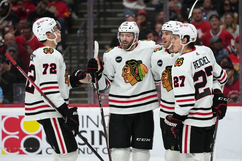 Nov 12, 2023; Sunrise, Florida, USA; Chicago Blackhawks center Jason Dickinson (16) celebrates his goal against the Florida Panthers with teammates on the ice during the first period at Amerant Bank Arena. Mandatory Credit: Jasen Vinlove-USA TODAY Sports