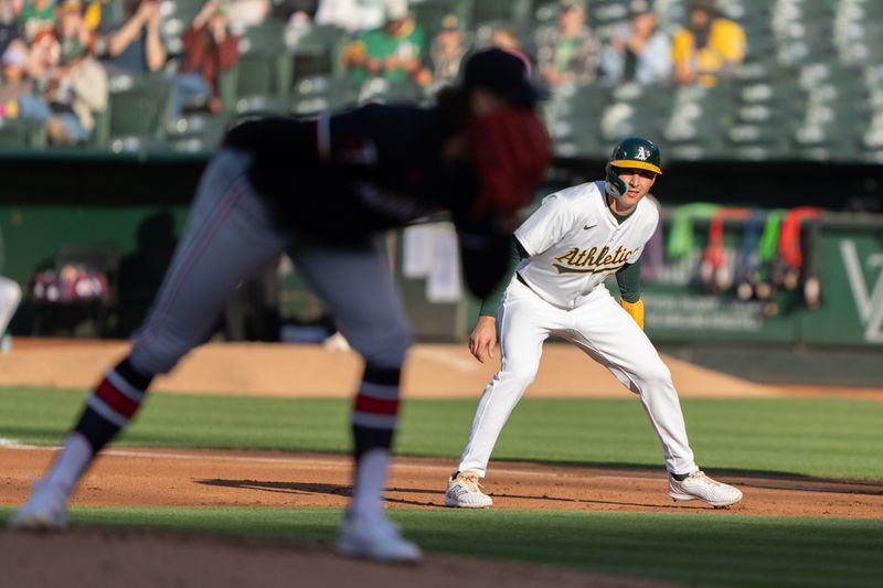 Jun 21, 2024; Oakland, California, USA; Oakland Athletics outfielder JJ Bleday (33) watches Minnesota Twins pitcher Chris Paddack (20) during the first inning at Oakland-Alameda County Coliseum. Mandatory Credit: Stan Szeto-USA TODAY Sports