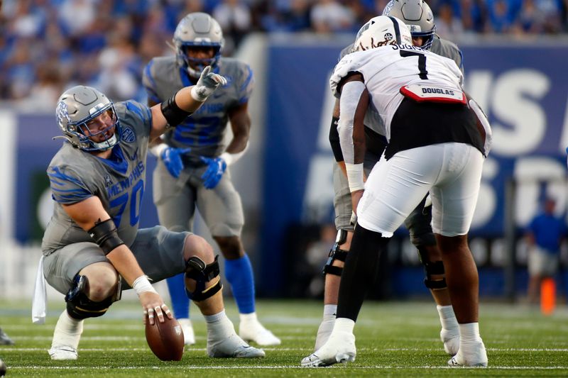 Sep 17, 2022; Memphis, Tennessee, USA; Memphis Tigers offensive linemen Jacob Likes (70) gives direction prior to the snap during the first half against the Arkansas State Red Wolves at Liberty Bowl Memorial Stadium. Mandatory Credit: Petre Thomas-USA TODAY Sports