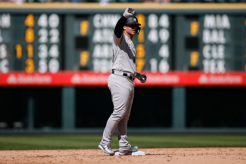 Jul 16, 2023; Denver, Colorado, USA; New York Yankees second baseman Gleyber Torres (25) reacts from second after reaching the base on a throwing error to first in the ninth inning against the Colorado Rockies at Coors Field. Mandatory Credit: Isaiah J. Downing-USA TODAY Sports