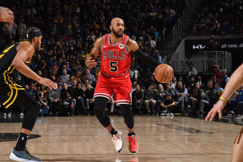 SAN FRANCISCO, CA - MARCH 7: Jevon Carter #5 of the Chicago Bulls handles the ball during the game against the Golden State Warriors on March 7, 2024 at Chase Center in San Francisco, California. NOTE TO USER: User expressly acknowledges and agrees that, by downloading and or using this photograph, user is consenting to the terms and conditions of Getty Images License Agreement. Mandatory Copyright Notice: Copyright 2024 NBAE (Photo by Noah Graham/NBAE via Getty Images)