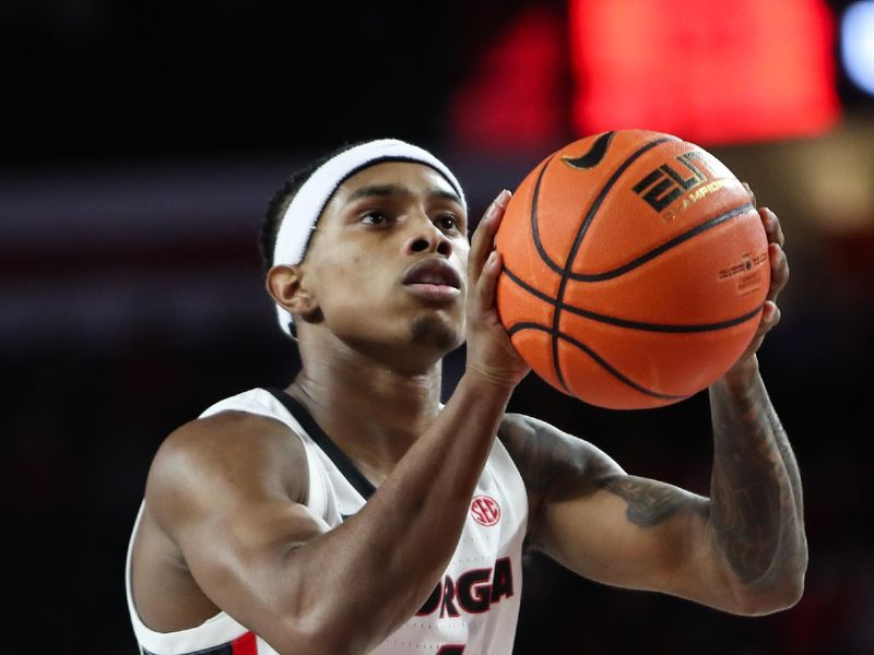 Dec 18, 2025; Athens, Georgia, USA; Georgia Bulldogs guard Marcus Millender (4) shoots a free throw against the Western Carolina Catamounts in the first half at Stegeman Coliseum. Mandatory Credit: Mady Mertens-Imagn Images