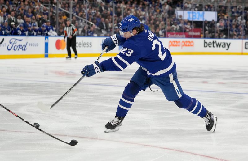 Apr 24, 2024; Toronto, Ontario, CAN; Toronto Maple Leafs forward Matthew Knies (23) shoots the puck against the Boston Bruins during the first period of game three of the first round of the 2024 Stanley Cup Playoffs at Scotiabank Arena. Mandatory Credit: John E. Sokolowski-USA TODAY Sports