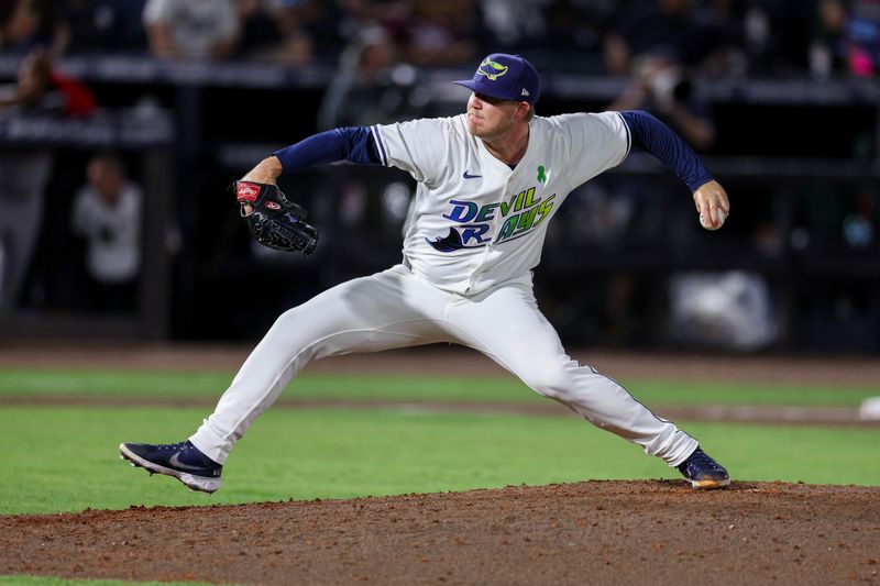 May 24, 2025; Tampa, Florida, USA; Tampa Bay Rays pitcher Garrett Cleavinger (60) throws a pitch against the Toronto Blue Jays in the sixth inning at George M. Steinbrenner Field. Mandatory Credit: Nathan Ray Seebeck-Imagn Images