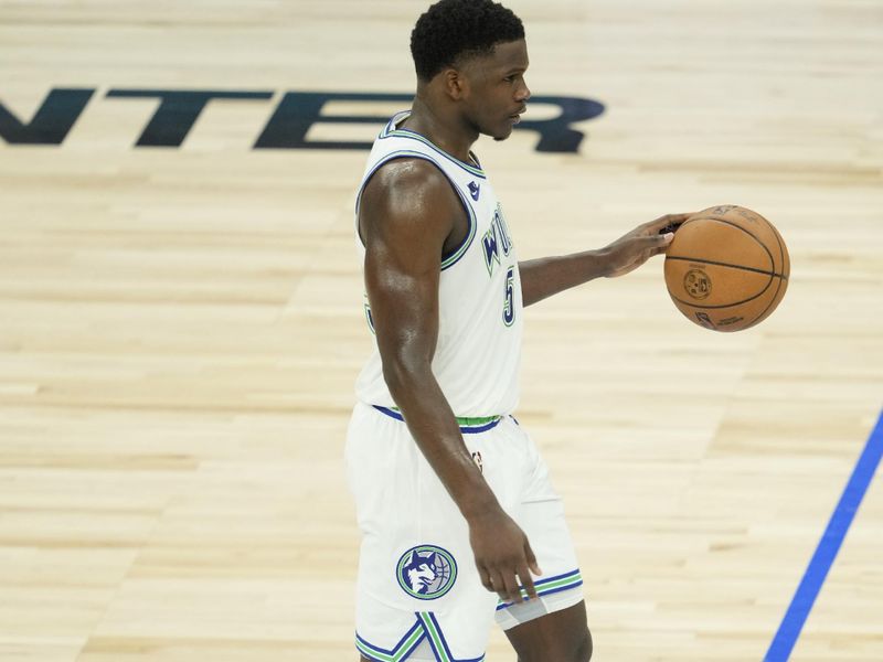 MINNEAPOLIS, MN -  MAY 16: Anthony Edwards #5 of the Minnesota Timberwolves dribbles the ball during the game against the Denver Nuggets during Round 2 Game 6 of the 2024 NBA Playoffs on May 16, 2024 at Target Center in Minneapolis, Minnesota. NOTE TO USER: User expressly acknowledges and agrees that, by downloading and or using this Photograph, user is consenting to the terms and conditions of the Getty Images License Agreement. Mandatory Copyright Notice: Copyright 2024 NBAE (Photo by Jordan Johnson/NBAE via Getty Images)