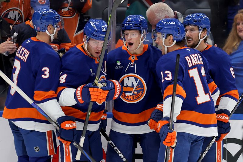 Nov 7, 2025; Elmont, New York, USA; New York Islanders left wing Emil Heineman (51) celebrates his goal against the Minnesota Wild with defenseman Adam Pelech (3) and centers Bo Horvat (14) and Mathew Barzal (13) and defenseman Ryan Pulock (6) during the second period at UBS Arena. Mandatory Credit: Brad Penner-Imagn Images