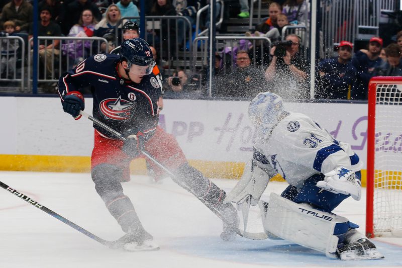 Nov 21, 2024; Columbus, Ohio, USA; Tampa Bay Lightning goalie Jonas Johansson (31) makes a save on the shot from Columbus Blue Jackets left wing Dmitri Voronkov (10) during the second period at Nationwide Arena. Mandatory Credit: Russell LaBounty-Imagn Images