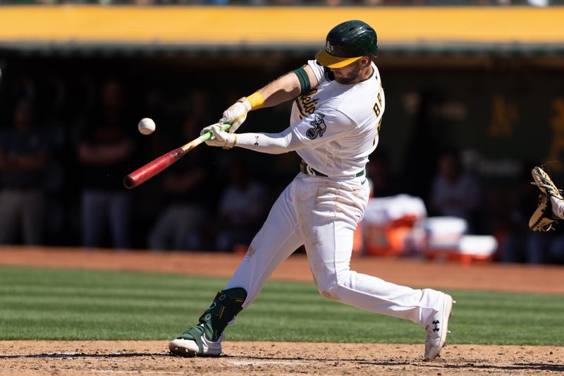 Aug 6, 2023; Oakland, California, USA;  Oakland Athletics left fielder Seth Brown (15) hits a double during the seventh inning against the San Francisco Giants at Oakland-Alameda County Coliseum. Mandatory Credit: Stan Szeto-USA TODAY Sports