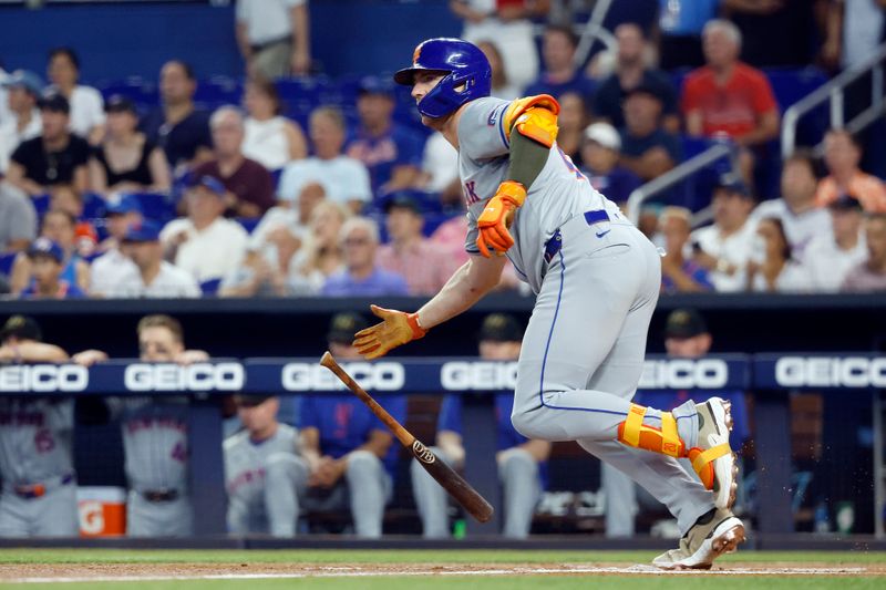 May 18, 2024; Miami, Florida, USA;  New York Mets first baseman Pete Alonso (20) singles against the Miami Marlins in the first inning at loanDepot Park. Mandatory Credit: Rhona Wise-USA TODAY Sports