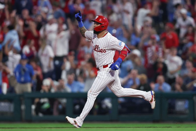 Sep 24, 2025; Philadelphia, Pennsylvania, USA;  Philadelphia Phillies short stop Edmundo Sosa runs the bases after hitting his third home run of the game during the seventh inning against the Miami Marlins at Citizens Bank Park. Mandatory Credit: Bill Streicher-Imagn Images