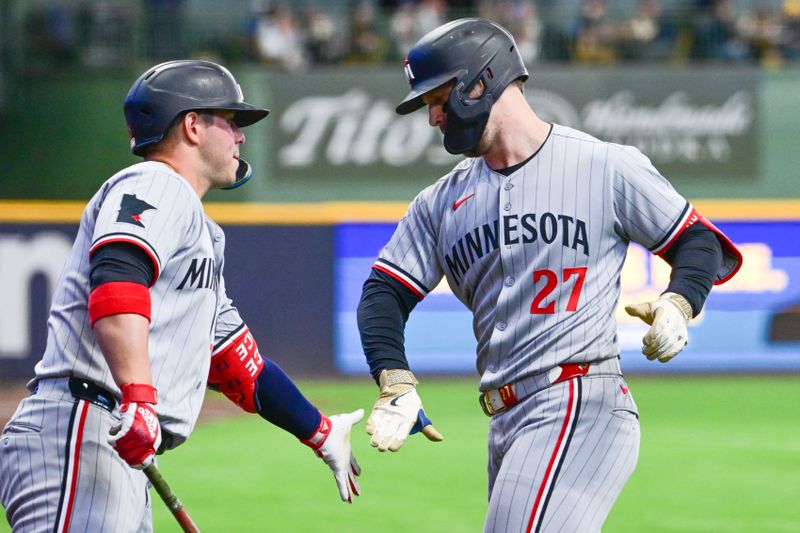 May 17, 2025; Milwaukee, Wisconsin, USA;  Minnesota Twins designated hitter Ryan Jeffers (27) is greeted by Minnesota Twins first baseman Ty France (13) after hitting solo home run in the first inning against the Milwaukee Brewers at American Family Field. Mandatory Credit: Benny Sieu-Imagn Images