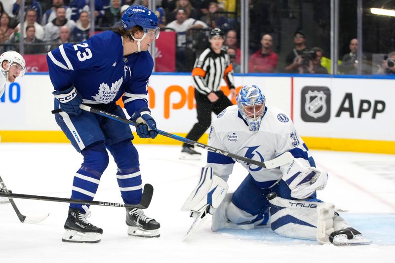 Oct 21, 2024; Toronto, Ontario, CAN; Tampa Bay Lightning goaltender Jonas Johansson (31) makes a save against Tampa Bay Lightning goaltender Jonas Johansson (31)  during the third period at Scotiabank Arena. Mandatory Credit: John E. Sokolowski-Imagn Images