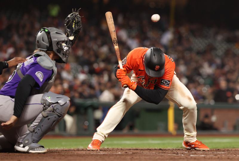 May 2, 2025; San Francisco, California, USA; San Francisco Giants third baseman Matt Chapman (26) ducks below the ball on a high pitch during the eighth inning against the Colorado Rockies at Oracle Park. Mandatory Credit: Kelley L Cox-Imagn Images