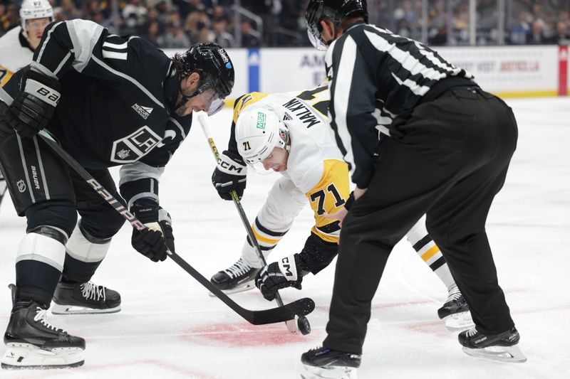 Nov 9, 2023; Los Angeles, California, USA; Los Angeles Kings center Anze Kopitar (11) faces off against Pittsburgh Penguins center Evgeni Malkin (71) during the first period at Crypto.com Arena. Mandatory Credit: Yannick Peterhans-USA TODAY Sports