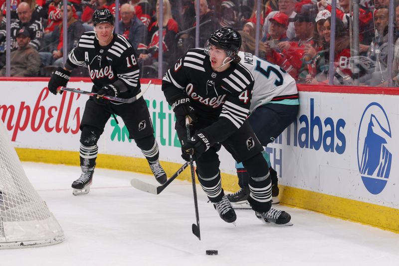 Jan 14, 2026; Newark, New Jersey, USA; New Jersey Devils defenseman Luke Hughes (43) skates with the puck against the Seattle Kraken during the second period at Prudential Center. Mandatory Credit: Ed Mulholland-Imagn Images