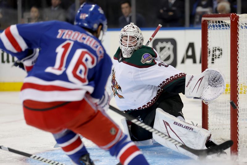 Oct 16, 2023; New York, New York, USA; Arizona Coyotes goaltender Connor Ingram (39) makes a save against New York Rangers center Vincent Trocheck (16) during the second period at Madison Square Garden. Mandatory Credit: Brad Penner-USA TODAY Sports