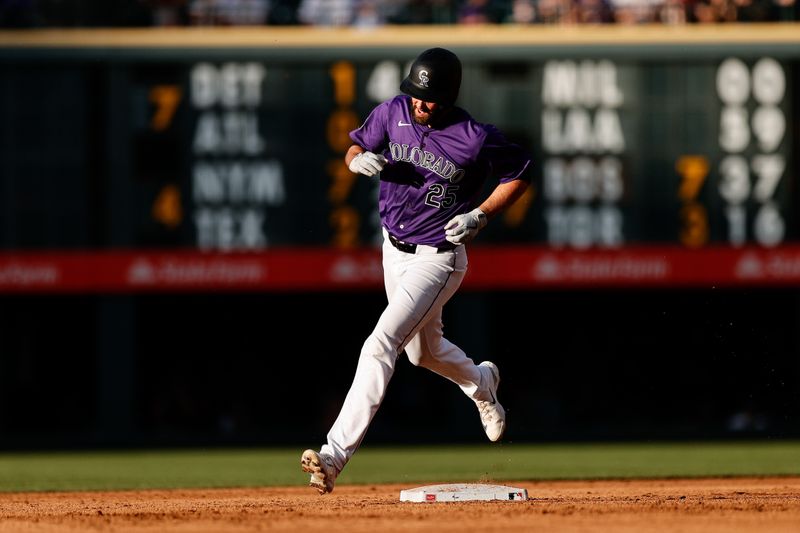 Jun 17, 2024; Denver, Colorado, USA; Colorado Rockies catcher Jacob Stallings (25) rounds second on a solo home run in the second inning against the Los Angeles Dodgers at Coors Field. Mandatory Credit: Isaiah J. Downing-USA TODAY Sports