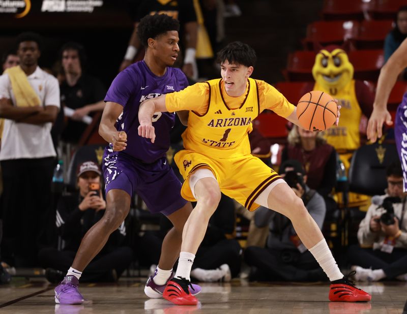 Jan 10, 2026; Tempe, Arizona, USA; Arizona State Sun Devils forward Santiago Trouet (1) moves the ball against Kansas State Wildcats forward Taj Manning (15) in the first half at Desert Financial Arena. Mandatory Credit: Mark J. Rebilas-Imagn Images