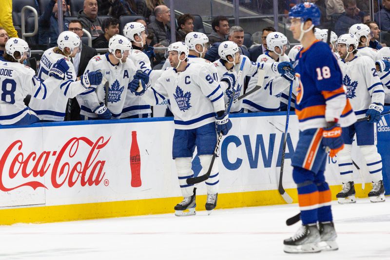 Dec 11, 2023; Elmont, New York, USA; Toronto Maple Leafs center John Tavares (91) celebrates his goal against the New York Islanders during the second period at UBS Arena. Mandatory Credit: Thomas Salus-USA TODAY Sports