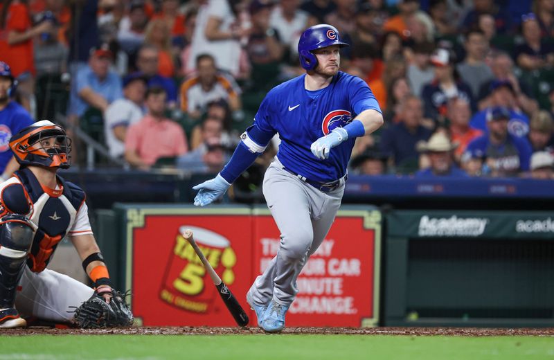 May 17, 2023; Houston, Texas, USA; Chicago Cubs left fielder Ian Happ (8) hits a double during the third inning against the Houston Astros at Minute Maid Park. Mandatory Credit: Troy Taormina-USA TODAY Sports