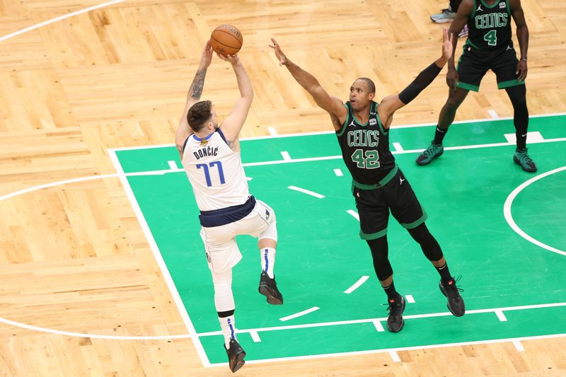 BOSTON, MA - JUNE 9: Luka Doncic #77 of the Dallas Mavericks shoots the ball during the game against the Boston Celtics during Game 2 of the 2024 NBA Finals on June 9, 2024 at the TD Garden in Boston, Massachusetts. NOTE TO USER: User expressly acknowledges and agrees that, by downloading and or using this photograph, User is consenting to the terms and conditions of the Getty Images License Agreement. Mandatory Copyright Notice: Copyright 2024 NBAE  (Photo by Joe Murphy/NBAE via Getty Images)