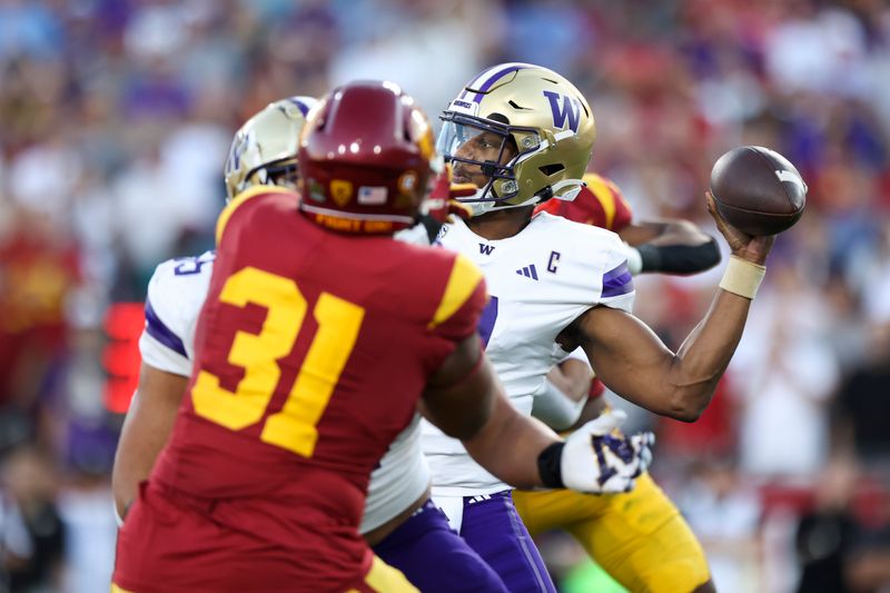 Nov 4, 2023; Los Angeles, California, USA; Washington Huskies quarterback Michael Penix Jr. (9) throws the ball  during the first quarter against the USC Trojans at United Airlines Field at Los Angeles Memorial Coliseum. Mandatory Credit: Jessica Alcheh-USA TODAY Sports