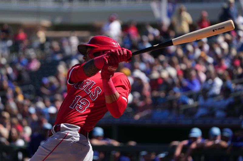 Mar 4, 2024; Surprise, Arizona, USA; Los Angeles Angels second baseman Ehire Adrianza (13) bats against the Texas Rangers during the first inning at Surprise Stadium. Mandatory Credit: Joe Camporeale-USA TODAY Sports