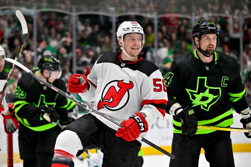 Mar 14, 2024; Dallas, Texas, USA; New Jersey Devils left wing Erik Haula (56) celebrates after he scores a goal as Dallas Stars left wing Jamie Benn (14) looks on during the first period at the American Airlines Center. Mandatory Credit: Jerome Miron-USA TODAY Sports