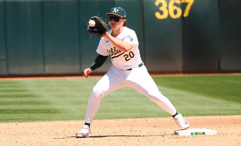 May 25, 2024; Oakland, California, USA; Oakland Athletics second baseman Zack Gelof (20) catches the ball against the Houston Astros during the sixth inning at Oakland-Alameda County Coliseum. Mandatory Credit: Kelley L Cox-USA TODAY Sports