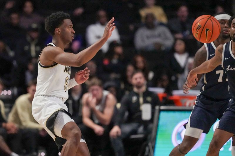Dec 17, 2025; Winston-Salem, North Carolina, USA;  Wake Forest Demon Deacons guard Myles Colvin (6) passes the ball against the Longwood Lancers during the second half at Lawrence Joel Veterans Memorial Coliseum. Mandatory Credit: Jim Dedmon-Imagn Images