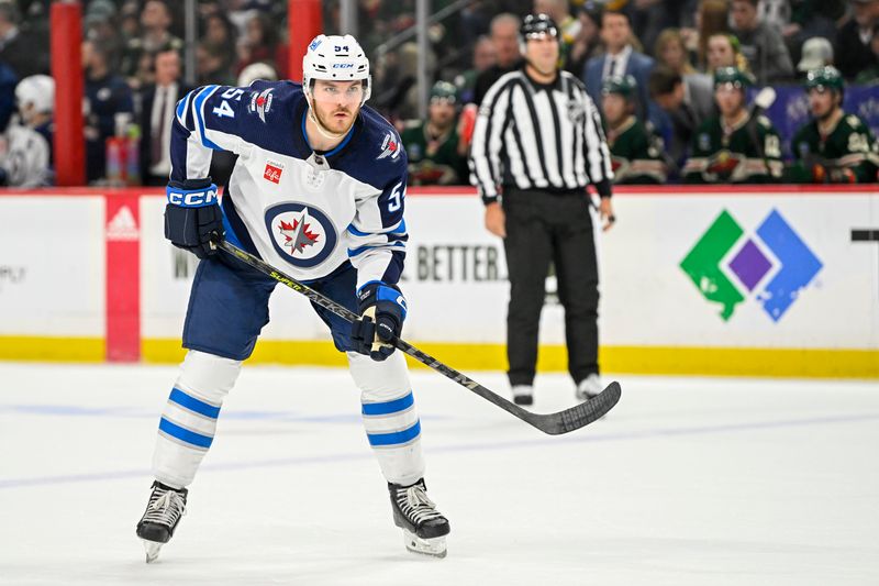 Apr 11, 2023; Saint Paul, Minnesota, USA;  Winnipeg Jets defense Dylan Samberg (54) gets into position against the Minnesota Wild during the third period at at Xcel Energy Center. Mandatory Credit: Nick Wosika-USA TODAY Sports