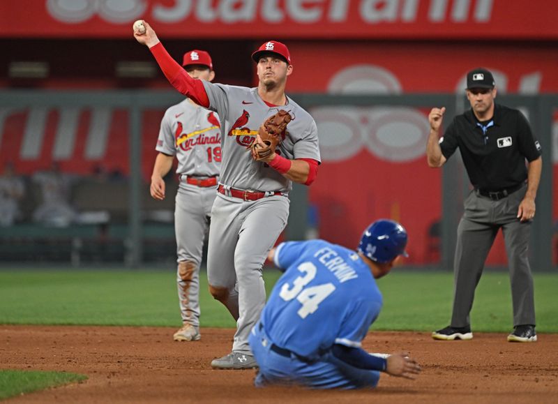 Aug 12, 2023; Kansas City, Missouri, USA;  St. Louis Cardinals second baseman Nolan Gorman (16) completes a double play against Kansas City Royals catcher Freddy Fermin (34) in the seventh inning at Kauffman Stadium. Mandatory Credit: Peter Aiken-USA TODAY Sports