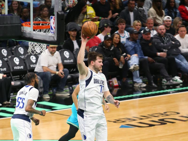 CHARLOTTE, NC - APRIL 9: Luka Doncic #77 of the Dallas Mavericks grabs the rebound during the game against the Charlotte Hornets on April 9, 2024 at Spectrum Center in Charlotte, North Carolina. NOTE TO USER: User expressly acknowledges and agrees that, by downloading and or using this photograph, User is consenting to the terms and conditions of the Getty Images License Agreement. Mandatory Copyright Notice: Copyright 2024 NBAE (Photo by Kent Smith/NBAE via Getty Images)