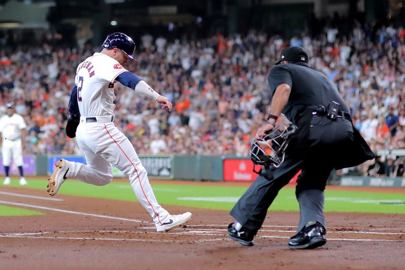 Jul 13, 2024; Houston, Texas, USA; Houston Astros third baseman Alex Bregman (2) crosses home plate to score a run against the Texas Rangers during the first inning at Minute Maid Park. Mandatory Credit: Erik Williams-USA TODAY Sports