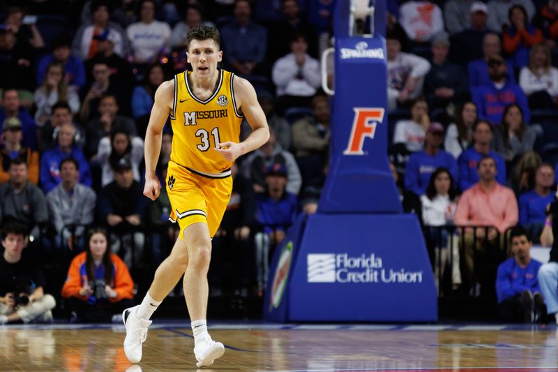 Jan 14, 2025; Gainesville, Florida, USA; Missouri Tigers guard Caleb Grill (31) runs against the Florida Gators during the first half at Exactech Arena at the Stephen C. O'Connell Center. Mandatory Credit: Matt Pendleton-Imagn Images