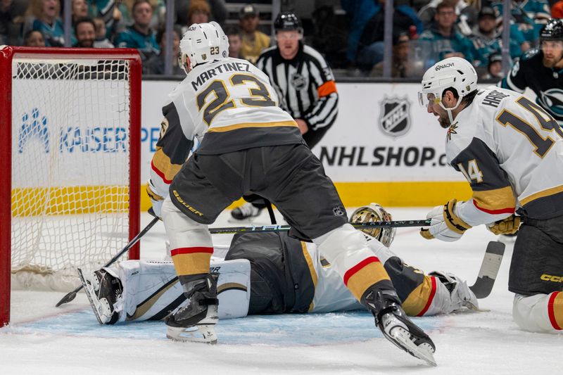 Feb 19, 2024; San Jose, California, USA; Vegas Golden Knights defenseman Alec Martinez (23) makes a save on the puck which skirted out the back of Vegas Golden Knights goaltender Logan Thompson (36) legs against the San Jose Sharks during the second period at SAP Center at San Jose. Mandatory Credit: Neville E. Guard-USA TODAY Sports