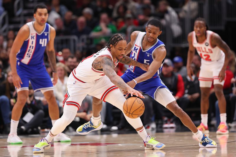 CHICAGO, ILLINOIS - FEBRUARY 03: De'Aaron Fox #5 of the Sacramento Kings attempts to steal the ball from DeMar DeRozan #11 of the Chicago Bulls during the first half at the United Center on February 03, 2024 in Chicago, Illinois. NOTE TO USER: User expressly acknowledges and agrees that, by downloading and or using this photograph, User is consenting to the terms and conditions of the Getty Images License Agreement.  (Photo by Michael Reaves/Getty Images)