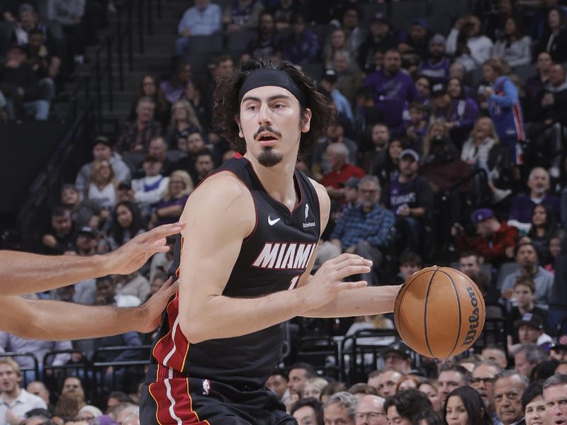 SACRAMENTO, CA - JANUARY 6:  Jaime Jaquez Jr. #11 of the Miami Heat dribbles the ball during the game against the Sacramento Kings January 6, 2025 at Golden 1 Center in Sacramento, California. NOTE TO USER: User expressly acknowledges and agrees that, by downloading and or using this Photograph, user is consenting to the terms and conditions of the Getty Images License Agreement. Mandatory Copyright Notice: Copyright 2025 NBAE (Photo by Rocky Widner/NBAE via Getty Images)