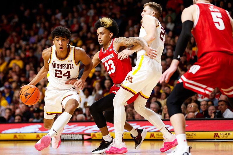 Jan 23, 2024; Minneapolis, Minnesota, USA; Minnesota Golden Gophers guard Cam Christie (24) works around Wisconsin Badgers guard Chucky Hepburn (23) during the first half at Williams Arena. Mandatory Credit: Matt Krohn-USA TODAY Sports