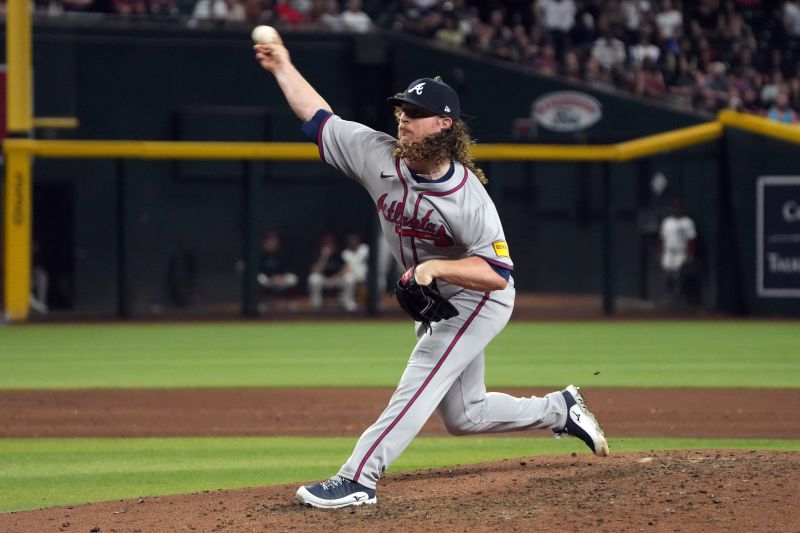 Jul 8, 2024; Phoenix, Arizona, USA; Atlanta Braves pitcher Grant Holmes (66) throws against the Arizona Diamondbacks in the sixth inning at Chase Field. Mandatory Credit: Rick Scuteri-USA TODAY Sports