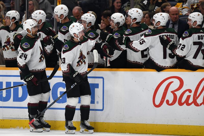 Nov 11, 2023; Nashville, Tennessee, USA; Arizona Coyotes left wing Michael Carcone (53) is congratulated by teammates after a goal during the first period against the Nashville Predators at Bridgestone Arena. Mandatory Credit: Christopher Hanewinckel-USA TODAY Sports